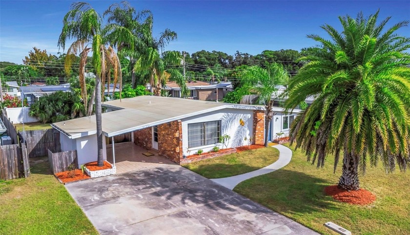 Coastal living at its best!!! Enjoy the beauty of an updated - Beach Home for sale in Dunedin, Florida on Beachhouse.com