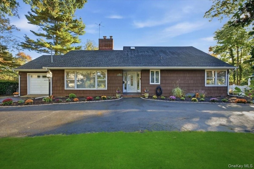 This beautifully maintained and well-appointed home is ready for - Beach Home for sale in Babylon, New York on Beachhouse.com