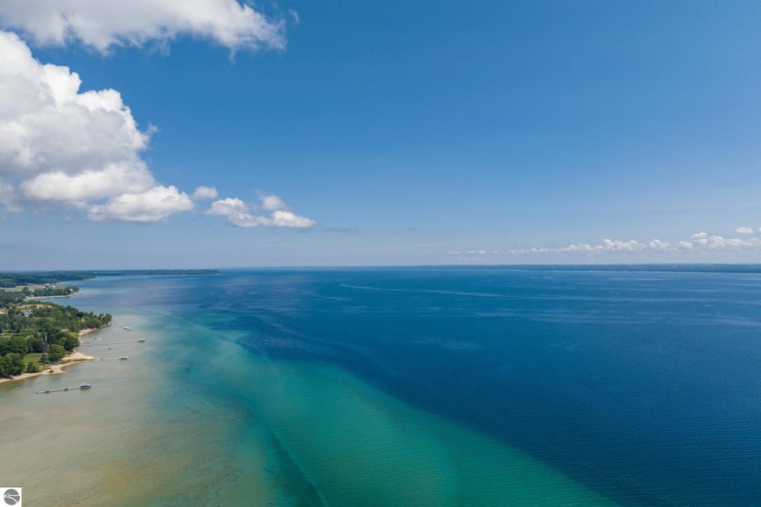 Waterfront Living on Old Mission Peninsula! Enjoy 110+ feet of - Beach Home for sale in Traverse City, Michigan on Beachhouse.com