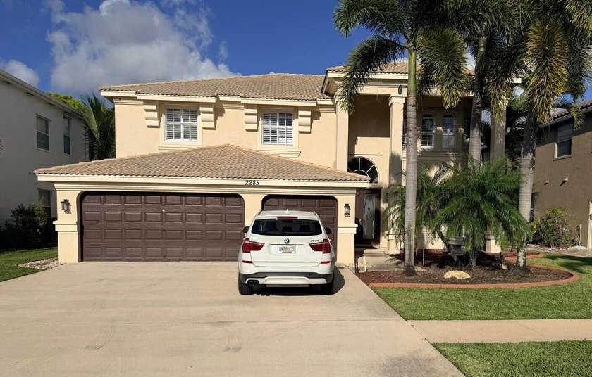 Beautiful Golf & Lake Front Home in desirable Madison Green - Beach Home for sale in Royal Palm Beach, Florida on Beachhouse.com
