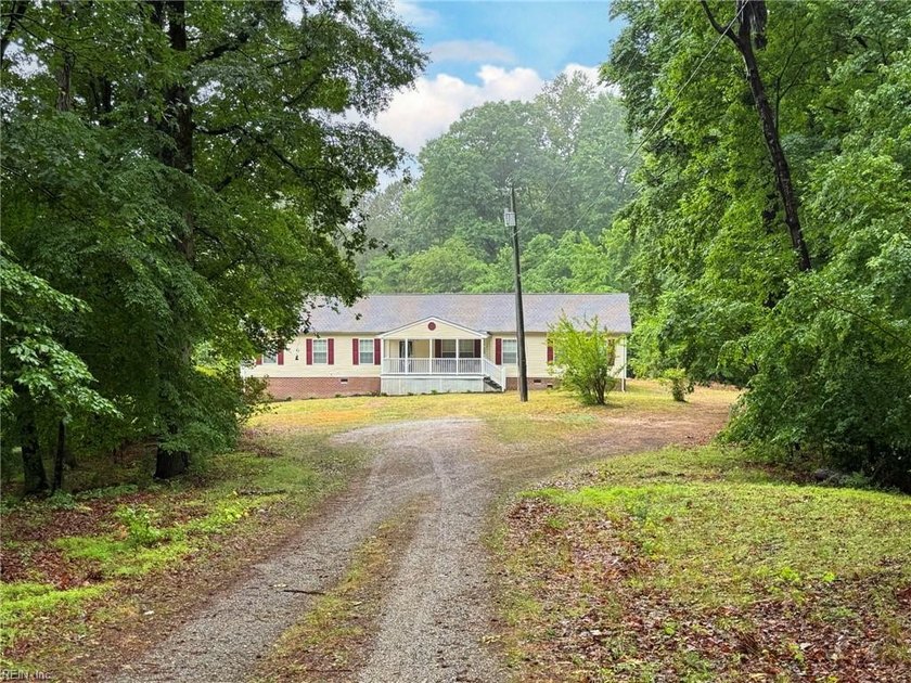 Nestled on a tranquil 5-acre wooded lot with a peaceful pond - Beach Home for sale in Gloucester, Virginia on Beachhouse.com