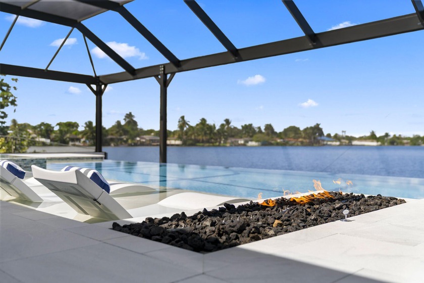 Stunning 4-bedroom, 4.5-bath lakefront home featuring a rare - Beach Home for sale in Miami, Florida on Beachhouse.com