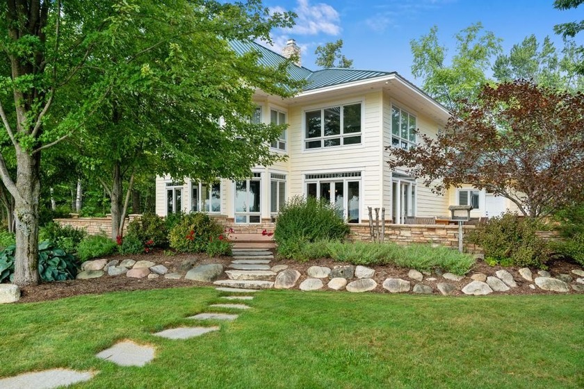Lakefront luxury on 4+/- acres embodies this stunning 3 bed, 3.5 - Beach Home for sale in Cheboygan, Michigan on Beachhouse.com