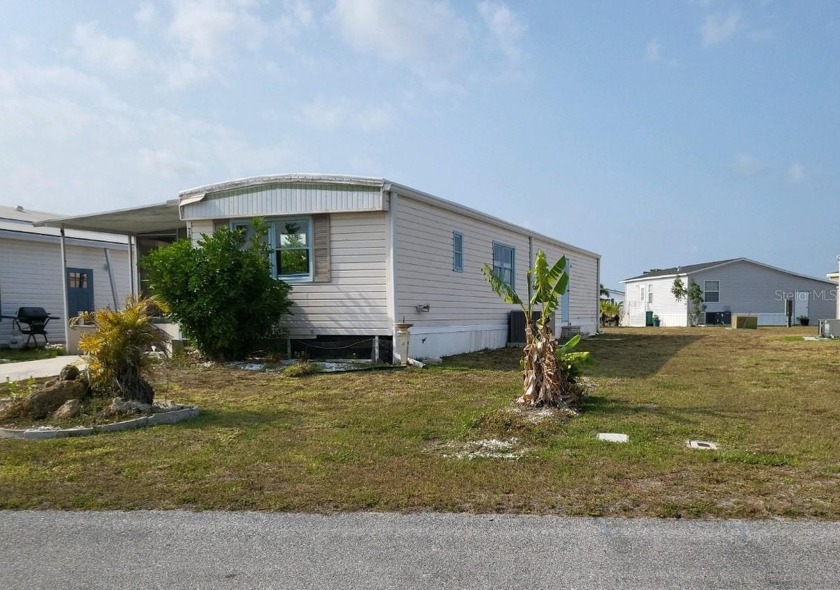 Located in the wonderful community of The Village of Holiday - Beach Home for sale in Port Charlotte, Florida on Beachhouse.com