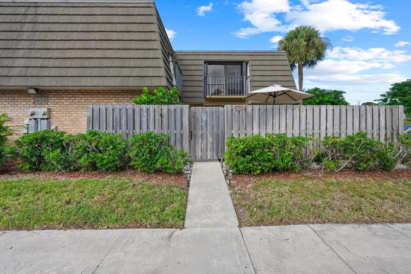 Come past the gate and find yourself in a private patio oasis - Beach Townhome/Townhouse for sale in West Palm Beach, Florida on Beachhouse.com