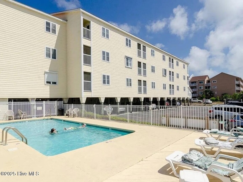 Top floor unit with great ocean views located in the Tropical - Beach Condo for sale in Carolina Beach, North Carolina on Beachhouse.com