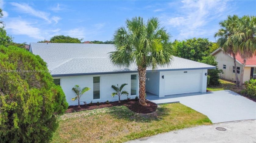 Stunning remodeled home with brand-new roof, impact windows, and - Beach Home for sale in Tamarac, Florida on Beachhouse.com