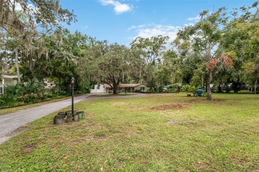 This beautiful lakefront well-maintained property sits on over - Beach Home for sale in Land O Lakes, Florida on Beachhouse.com