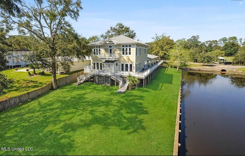 This exceptional waterfront home is situated on a full acre in - Beach Home for sale in Gulfport, Mississippi on Beachhouse.com