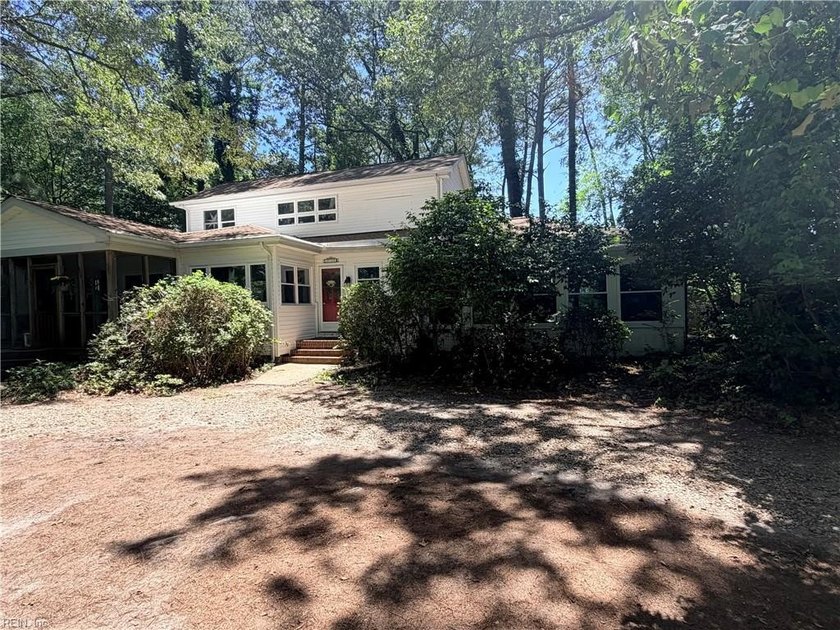 Drive up to this private 4-bedroom, 4-bath home on a wooded - Beach Home for sale in Chesapeake, Virginia on Beachhouse.com