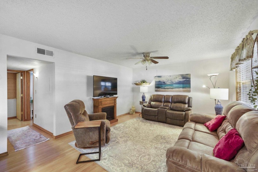 Welcome to easy living in this furnished, low maintenance 1st - Beach Home for sale in Gulf Breeze, Florida on Beachhouse.com
