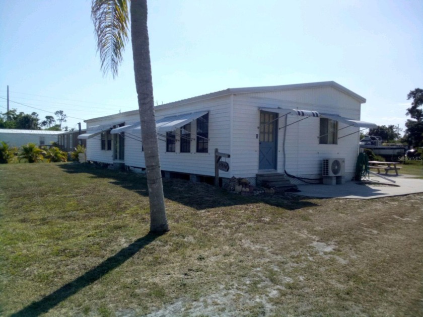 Located on a large 12,221 sq ft partially fenced lot in the - Beach Home for sale in Punta Gorda, Florida on Beachhouse.com