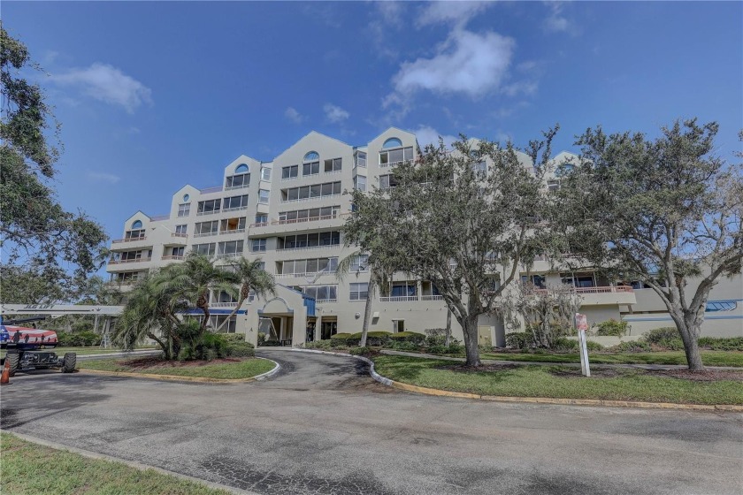 Perched on the top floor of Crystal Bay, this fourth-story condo - Beach Condo for sale in Clearwater, Florida on Beachhouse.com