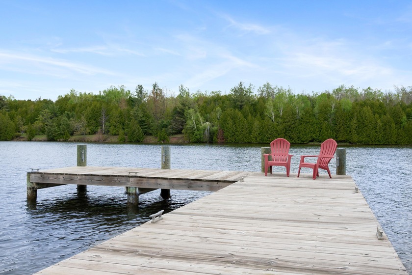 Nestled along the Black River, part of Michigan's renowned - Beach Home for sale in Cheboygan, Michigan on Beachhouse.com