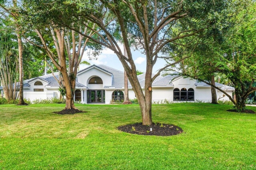 Situated on over an acre, this 5 bedrooms and 4.5 bath estate - Beach Home for sale in Boynton Beach, Florida on Beachhouse.com