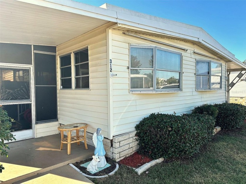 Inviting  2 bedroom, 2 bath, Doublewide, with 9x20 Sunny Florida - Beach Home for sale in Pinellas Park, Florida on Beachhouse.com