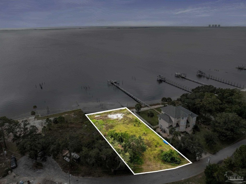 Discover the epitome of waterfront living on this exclusive - Beach Lot for sale in Gulf Breeze, Florida on Beachhouse.com