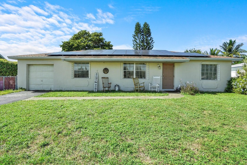 Opportunity knocks! This 3-bedroom, 2-bath home with a 1-car - Beach Home for sale in Boca Raton, Florida on Beachhouse.com