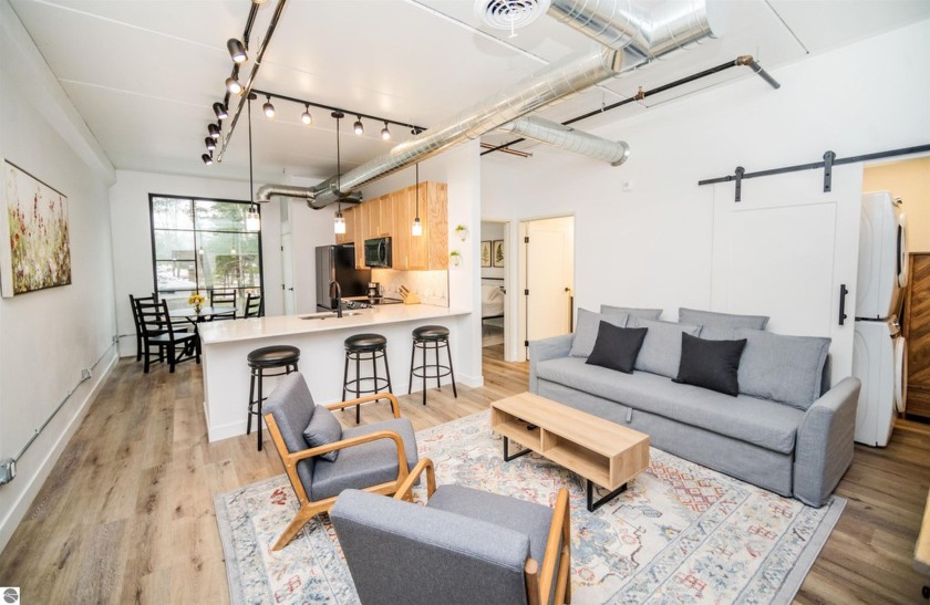 Welcome to this newly built 1-bedroom, 1-bathroom condo that - Beach Condo for sale in Traverse City, Michigan on Beachhouse.com