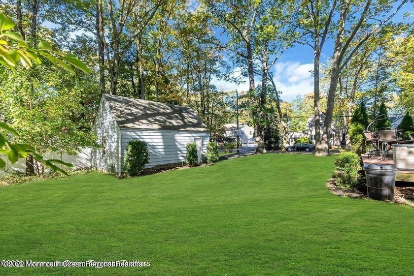Perfect opportunity to own this 4-bedroom, 2-bath Cape situated - Beach Home for sale in Oakhurst, New Jersey on Beachhouse.com