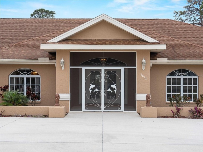 Discover elegance and coastal charm at 1611 Thomas St, a - Beach Home for sale in Englewood, Florida on Beachhouse.com