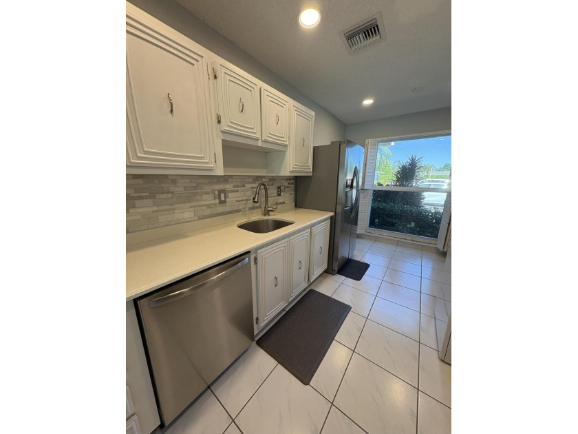 WELCOME TO THIS LIGHT FILLED 1 LEVEL VILLA IN PALM GREENS ADULT - Beach Home for sale in Delray Beach, Florida on Beachhouse.com