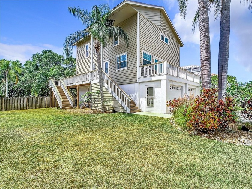 Beautiful elevated Key West style home in spectacular Crossing - Beach Home for sale in Seminole, Florida on Beachhouse.com