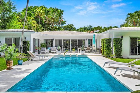 Welcome to this mid-century tropical oasis on a large ~12k sqft - Beach Home for sale in Coral Gables, Florida on Beachhouse.com