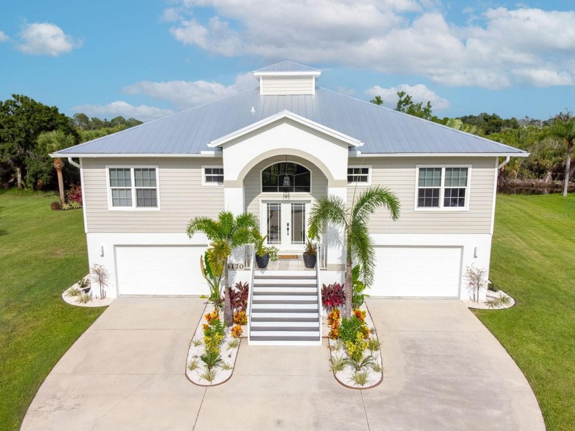 This LUXURIOUS KEY WEST STYLE POOL HOME offers the perfect blend - Beach Home for sale in Englewood, Florida on Beachhouse.com