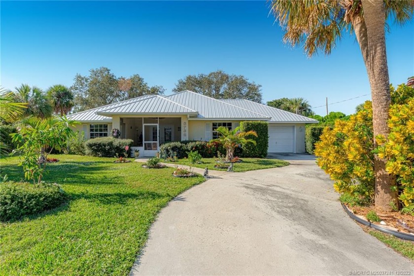 Hunker down in this solid CBS home built in 1996 with a 2022 - Beach Home for sale in Jensen Beach, Florida on Beachhouse.com