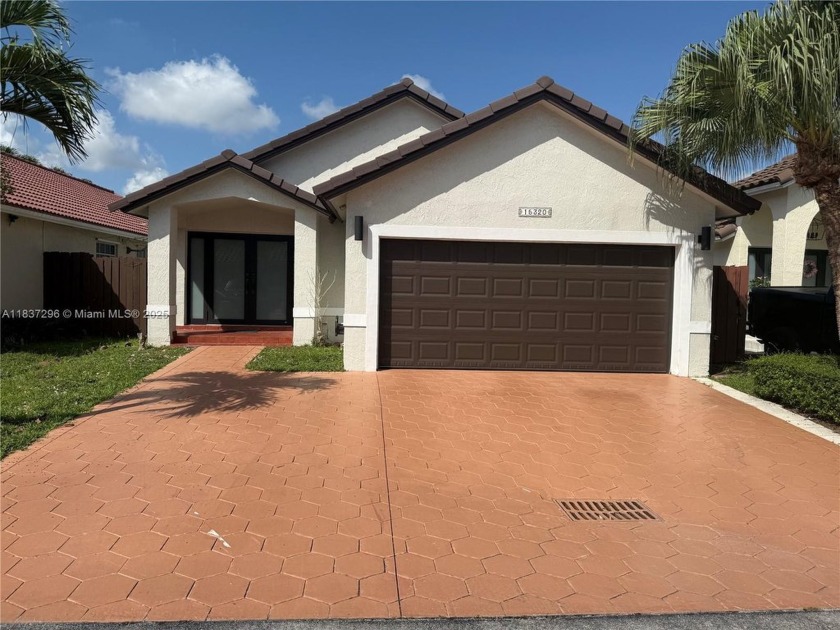 This cozy 3-bedroom, 2-bath home with a den features a two-car - Beach Home for sale in Miami, Florida on Beachhouse.com