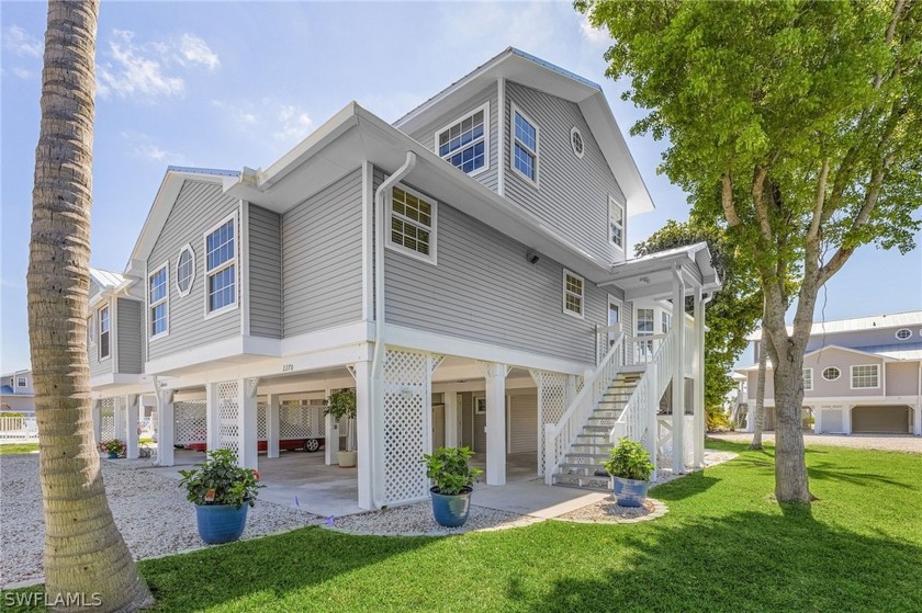 Welcome to this exquisite, elevated 2-story townhome nestled in - Beach Townhome/Townhouse for sale in ST. James City, Florida on Beachhouse.com