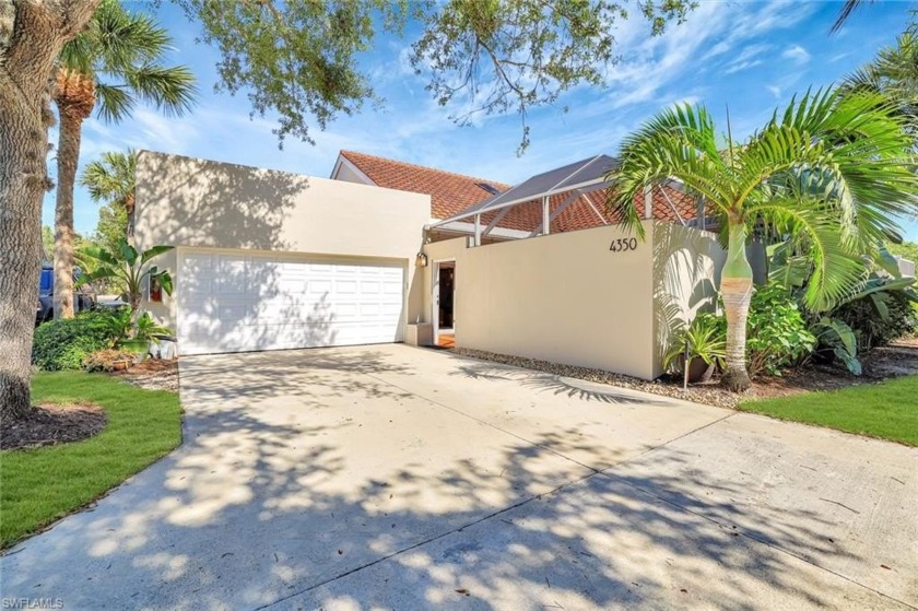 Discover the charm of this stunning Courtyard Villa, featuring a - Beach Home for sale in Naples, Florida on Beachhouse.com