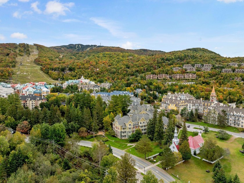 Enjoy elevated Tremblant resort living at the Ermitage du Lac - Beach Condo for sale in Mont-Tremblant, Quebec on Beachhouse.com