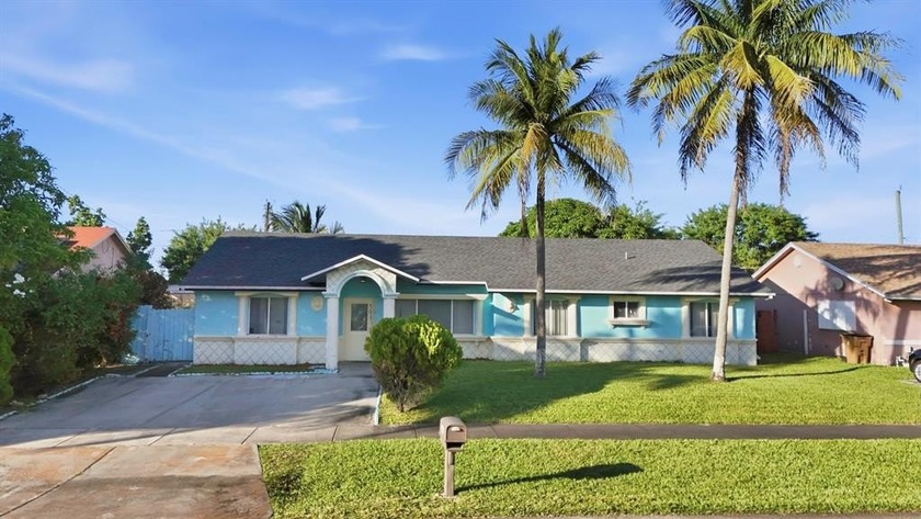 Discover this charming 4-bedroom, 2-bath single-family home in - Beach Home for sale in Deerfield Beach, Florida on Beachhouse.com