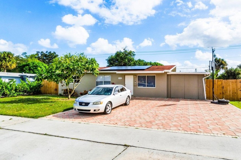 Excellent opportunity to own a beautiful Pool Home in red hot - Beach Home for sale in Lake Park, Florida on Beachhouse.com