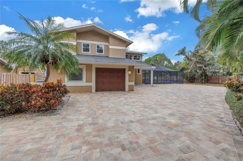 Welcome to 6070 Oakhurst Drive, a custom built residence in the - Beach Home for sale in Seminole, Florida on Beachhouse.com