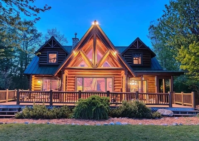This log home was once featured on the cover of a major magazine - Beach Home for sale in Moran, Michigan on Beachhouse.com