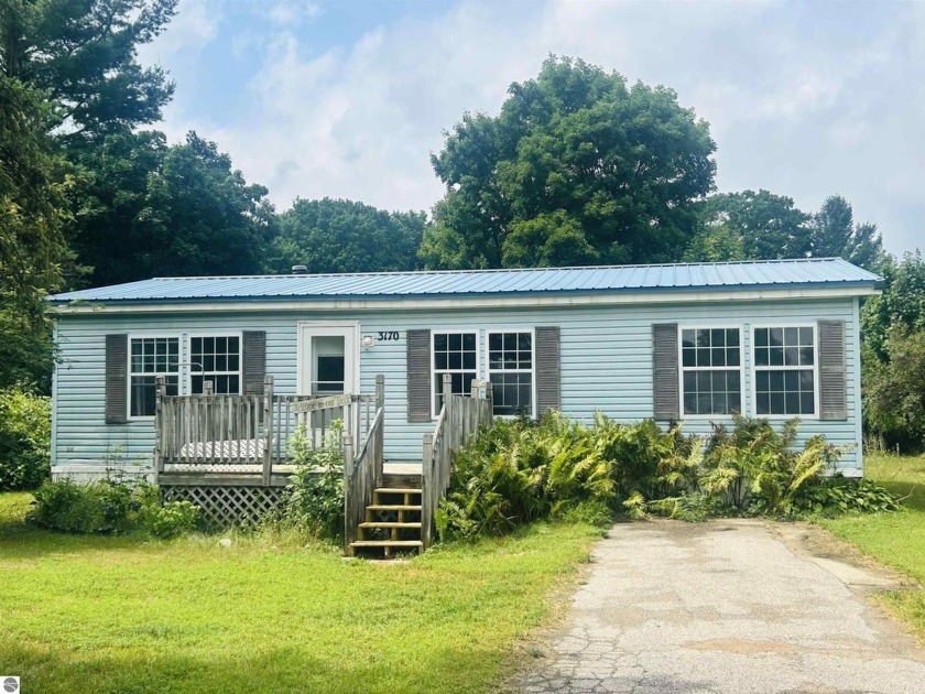 Step outside and take in the natural beauty that surrounds this - Beach Home for sale in Traverse City, Michigan on Beachhouse.com
