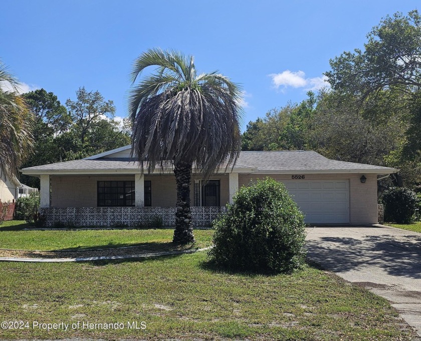 This charming three-bedroom, two-bathroom residence boasts a - Beach Home for sale in Spring Hill, Florida on Beachhouse.com