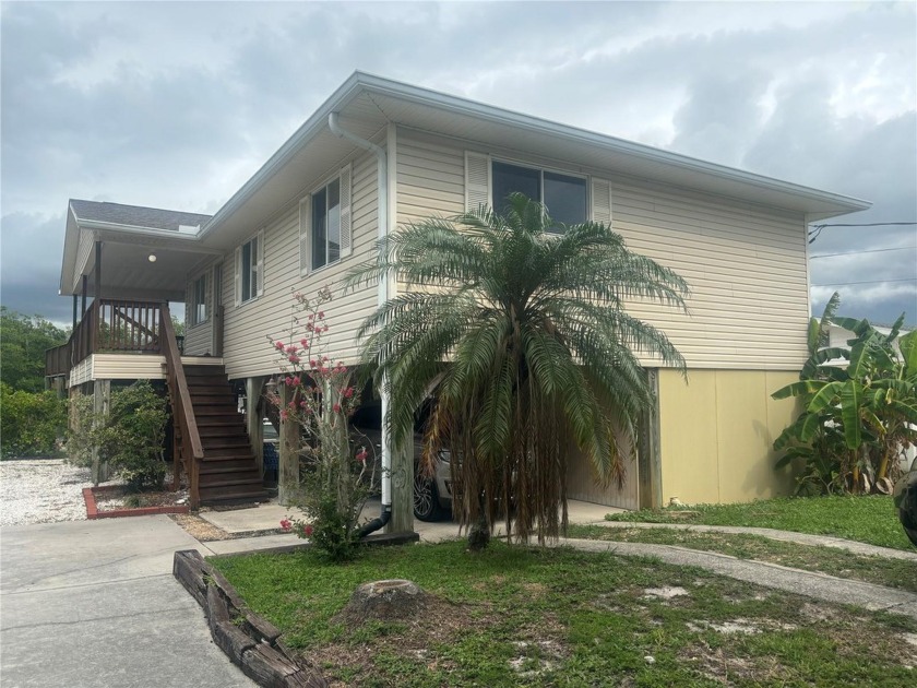 WONDERFUL WATERFRONT STILT 3/2 HOME JUST 3 LOTS AWAY FROM THE - Beach Home for sale in Ruskin, Florida on Beachhouse.com