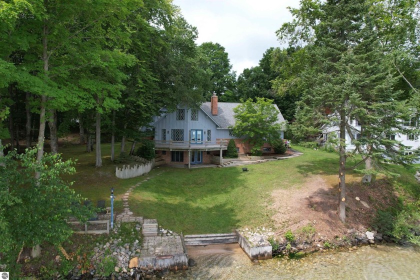 Renowned Torch Lake, enjoy 150 ft. frontage on a 2.5 acre lot - Beach Home for sale in Kewadin, Michigan on Beachhouse.com