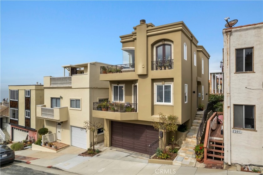 This stunning Mediterranean-style single family home is situated - Beach Home for sale in Manhattan Beach, California on Beachhouse.com