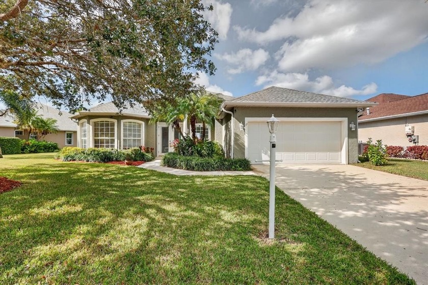 Located in desirable Hammock Lakes, this immaculate lakefront - Beach Home for sale in Vero Beach, Florida on Beachhouse.com