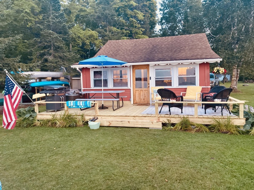 Escape to the serenity of Long Lake in this charming, updated - Beach Home for sale in Alpena, Michigan on Beachhouse.com