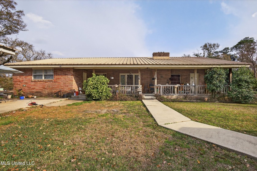 Tucked privately off the road, this versatile horse farm offers - Beach Home for sale in Gulfport, Mississippi on Beachhouse.com