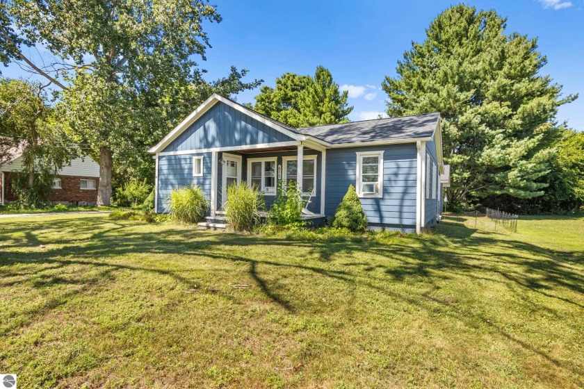 This four bedroom house with a double lot checks all the boxes - Beach Home for sale in Elk Rapids, Michigan on Beachhouse.com