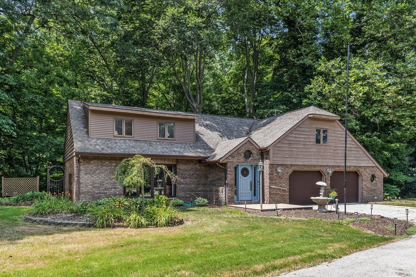 Situated in a serene, private cul-de-sac, this distinguished - Beach Home for sale in Saint Joseph, Michigan on Beachhouse.com