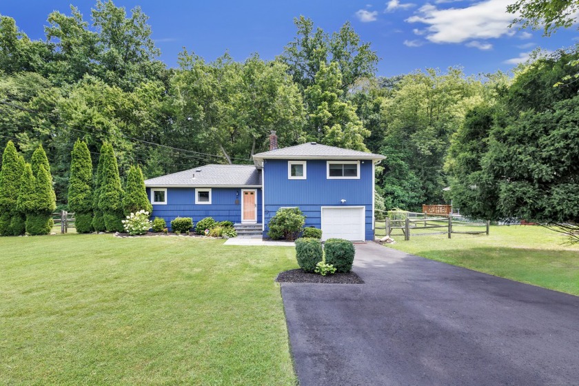 Picturesque 3 bedroom, 2 full bathroom split-level home nestled - Beach Home for sale in Norwalk, Connecticut on Beachhouse.com