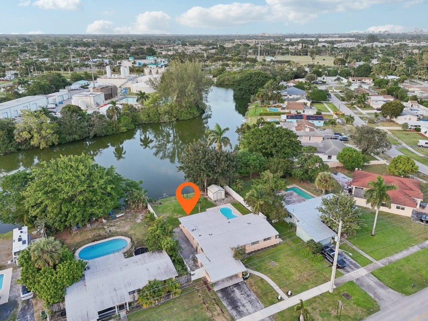 Welcome to this charming waterfront oasis located in the heart - Beach Home for sale in Palm Springs, Florida on Beachhouse.com